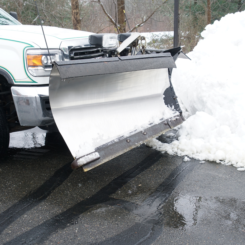 white truck with snow plow